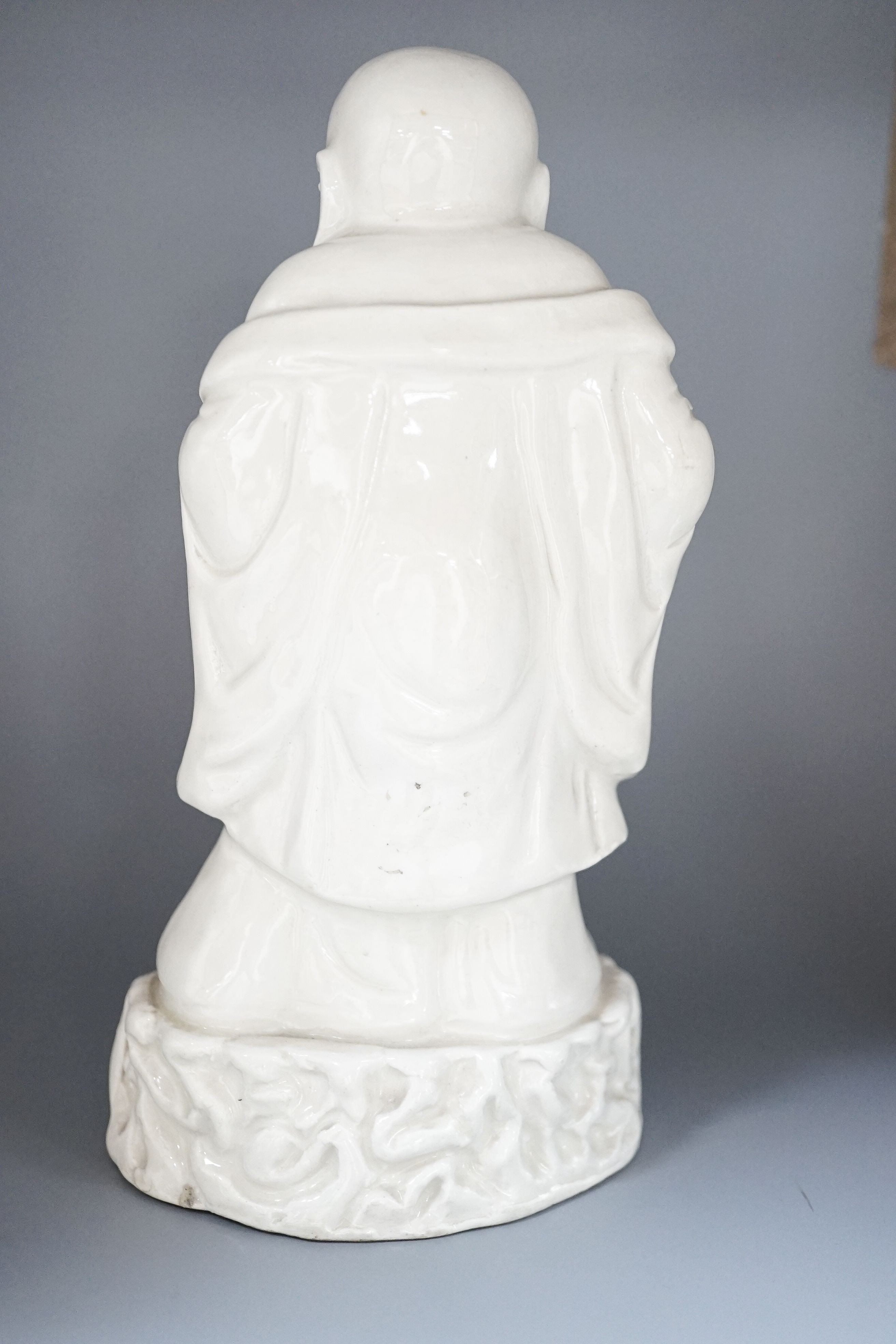 A Chinese blanc-de-chine figure of Budai, 19cm